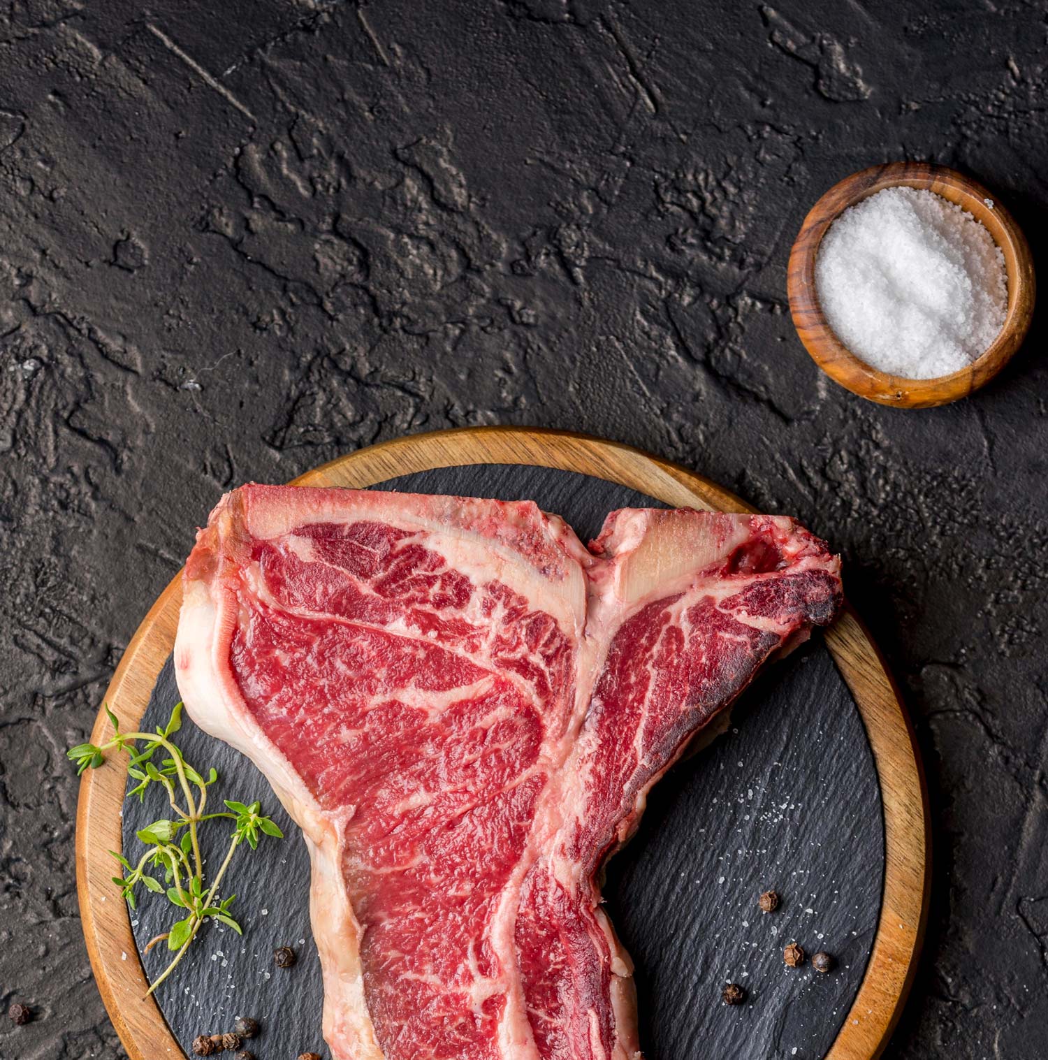 Premium raw meat selection on wooden board